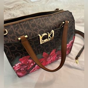 Calvin Klein monogram purse with flower detail